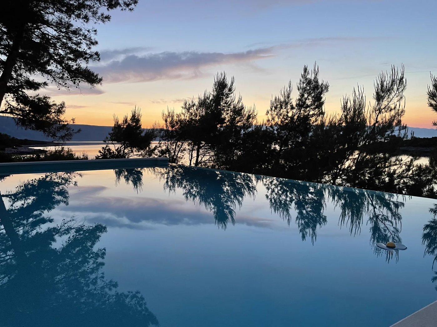 Villa Aqua infinity pool at dusk